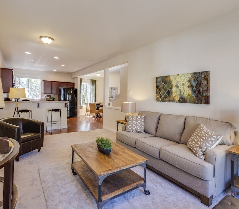 Furnished flat with the sofa, dining set and kitchen still in place